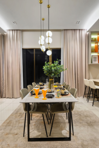 Modern Dining Room Table with statement lighting above