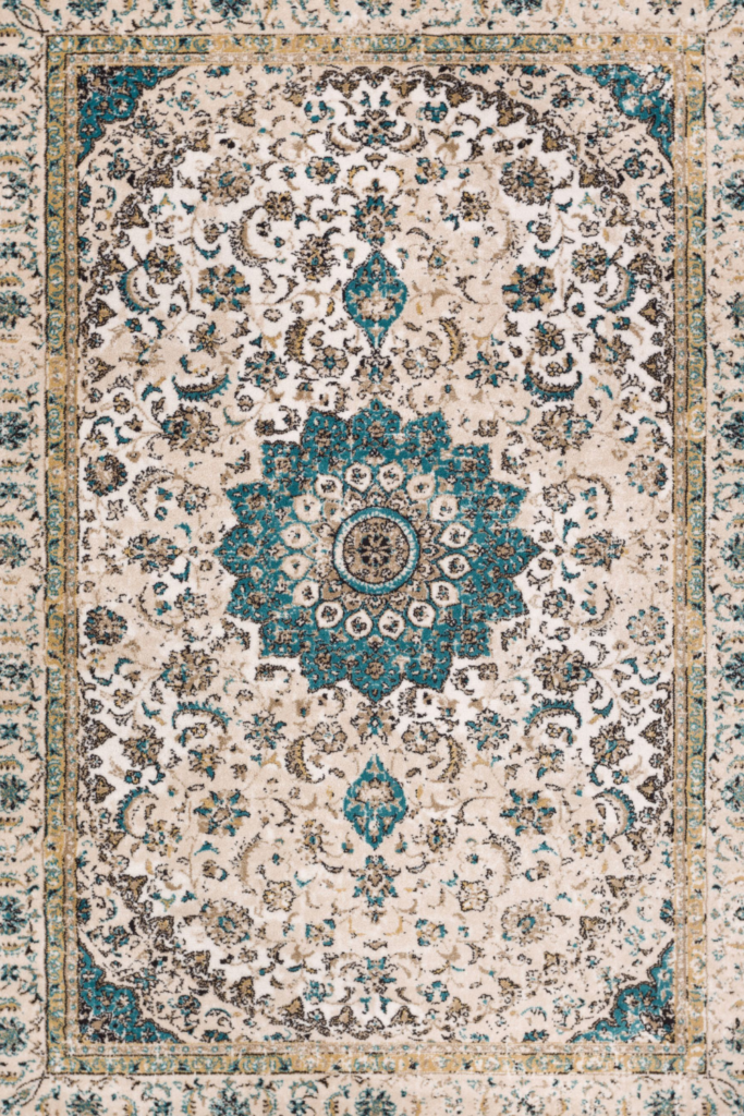 Soft, patterned decorative rug placed beside a bed in a cozy bedroom, adding warmth, texture, and budget-friendly style to the space.