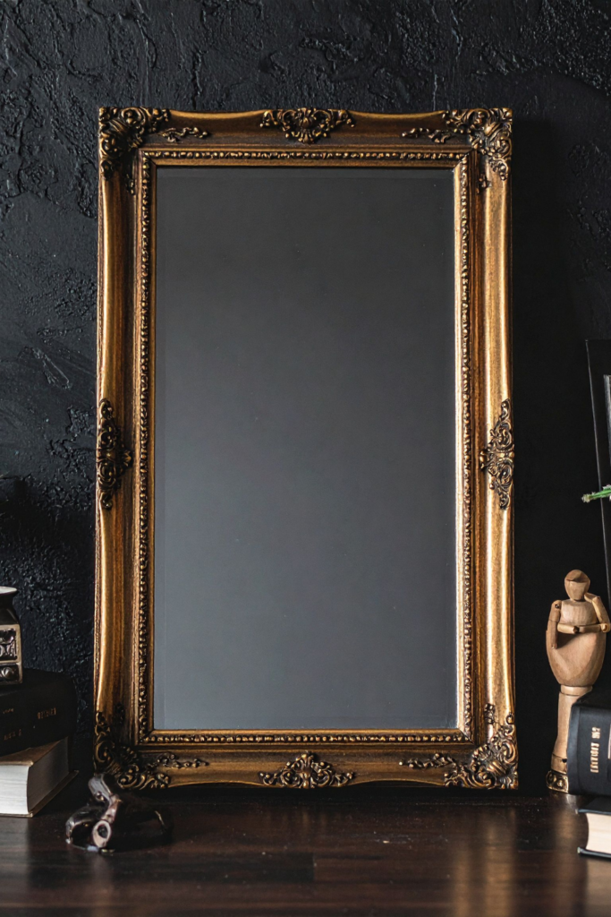 Set of golden picture frames displayed on a wall, adding elegant, stylish, and budget-friendly home decor for living rooms, bedrooms, and gallery walls.