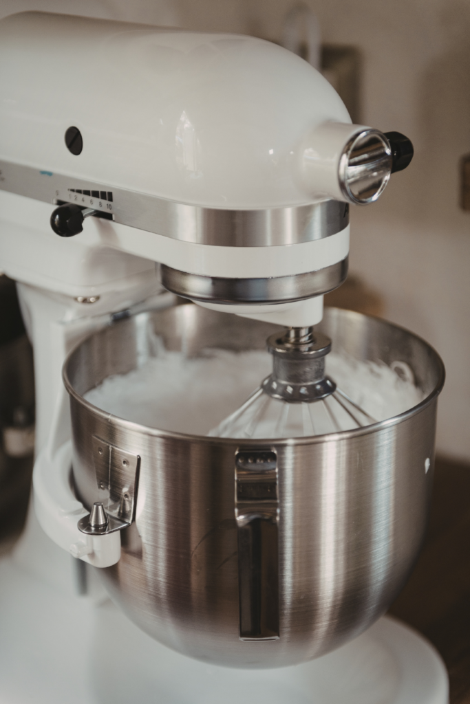 KitchenAid Stand Mixer whipping cake batter in home kitchen. 