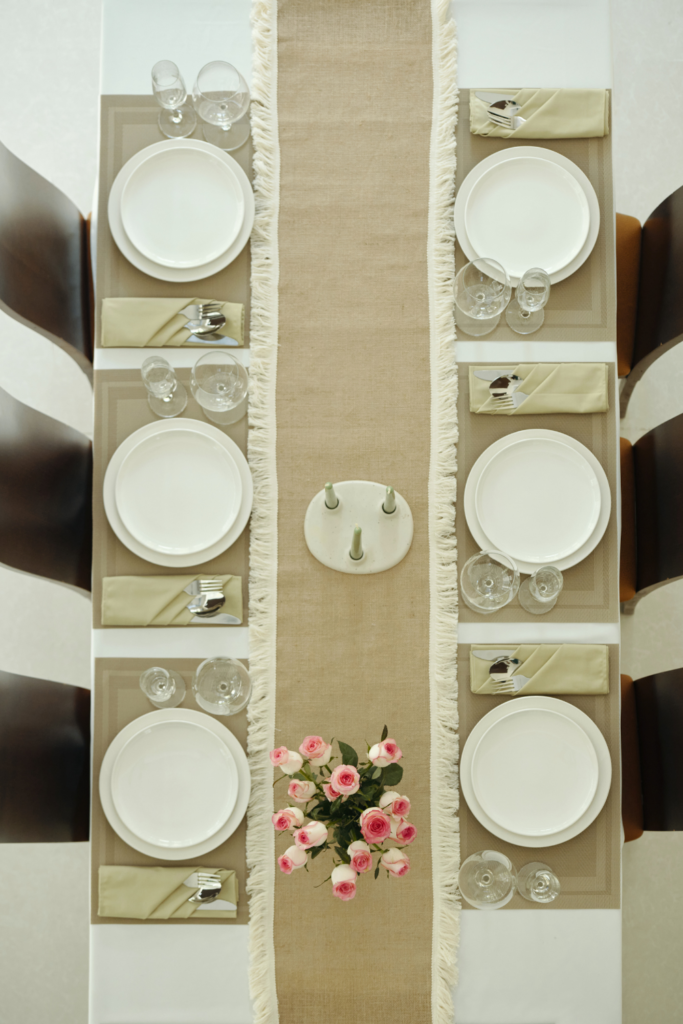 Stylish table runner on dining table adding color and texture to dining room.