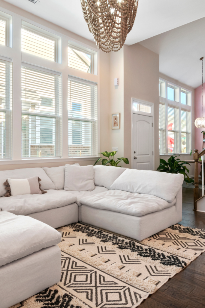 Neutral U-Shaped Sofa in living room with cozy rug underneath